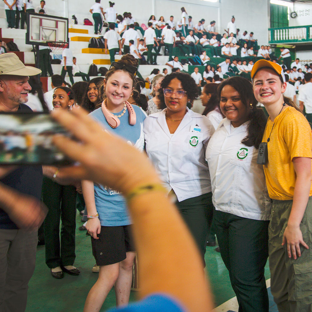 Mission team members with students